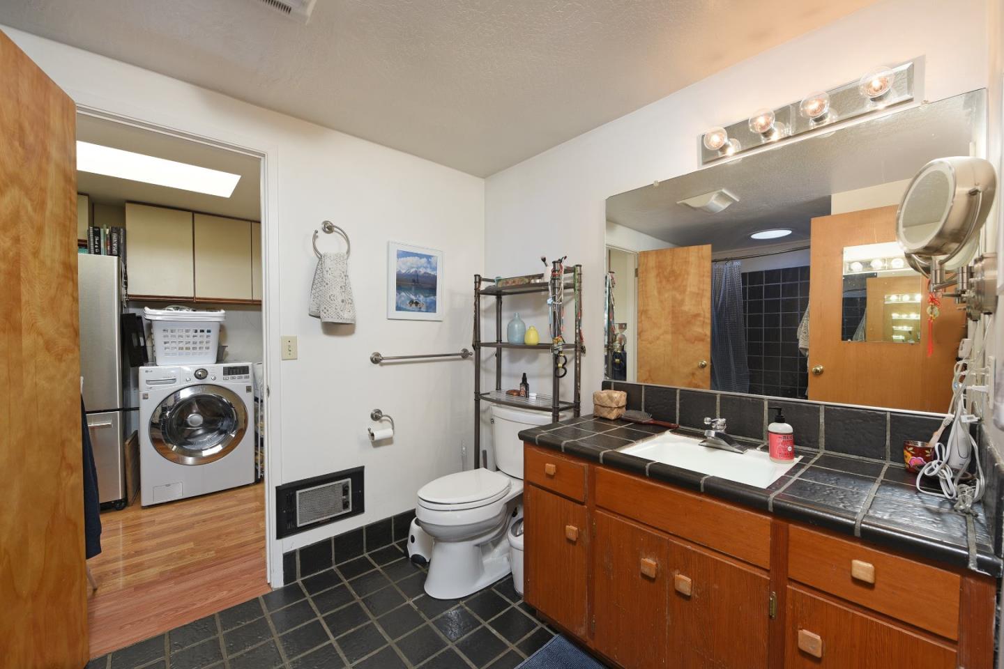 87 Upenuf Road Woodside, CA 94062 - Photo 23 of 42 a bathroom with a toilet a sink and mirror