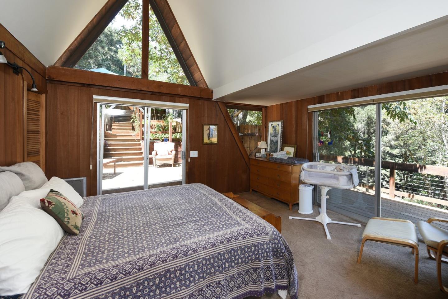87 Upenuf Road Woodside, CA 94062 - Photo 24 of 42 a bedroom with a large bed and a large window