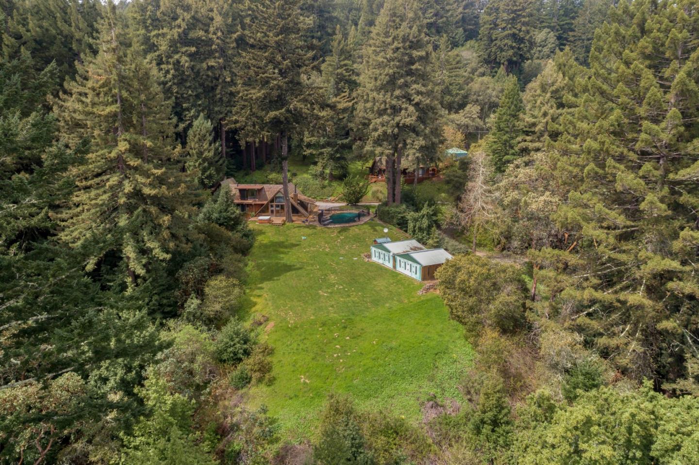 87 Upenuf Road Woodside, CA 94062 - Photo 30 of 42 a backyard of a house with table and chairs