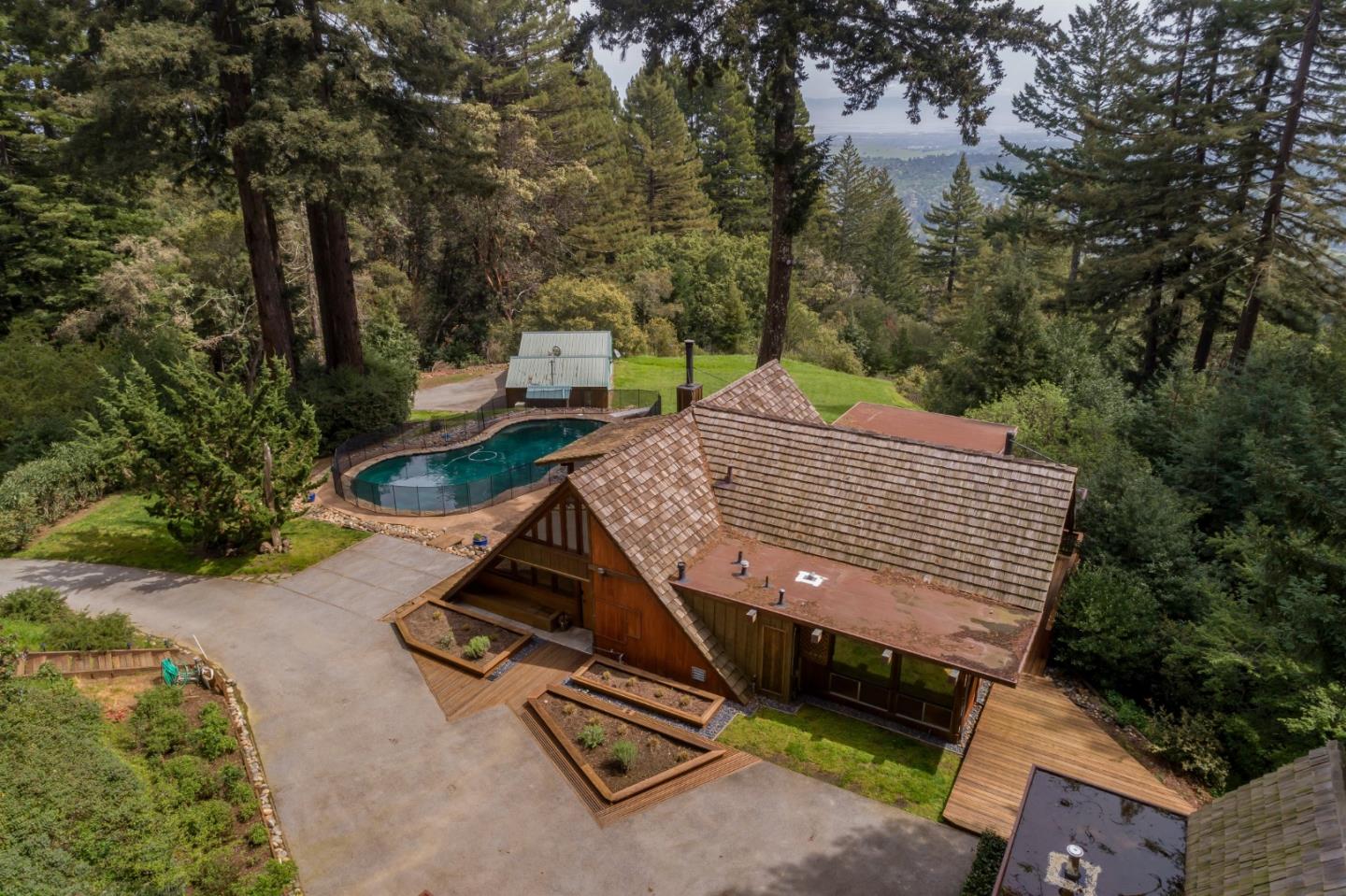 87 Upenuf Road Woodside, CA 94062 - Photo 39 of 42 an aerial view of a house with swimming pool and trees