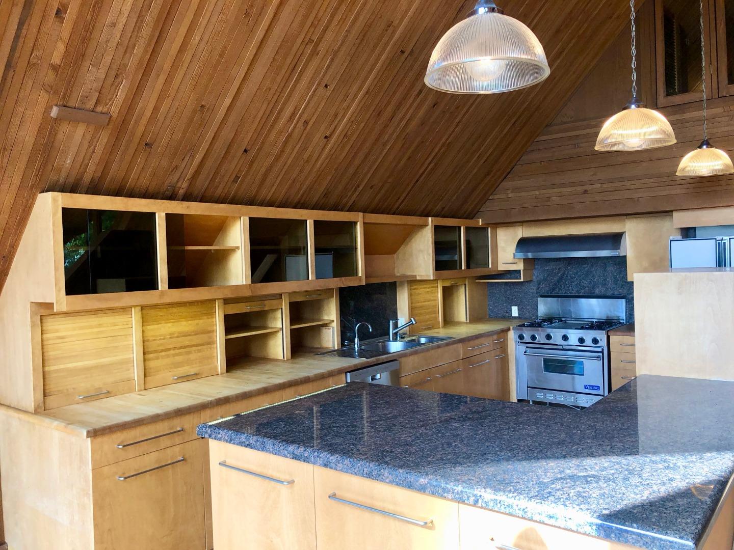 87 Upenuf Road Woodside, CA 94062 - Photo 9 of 42 a kitchen with stainless steel appliances granite countertop a sink stove and microwave