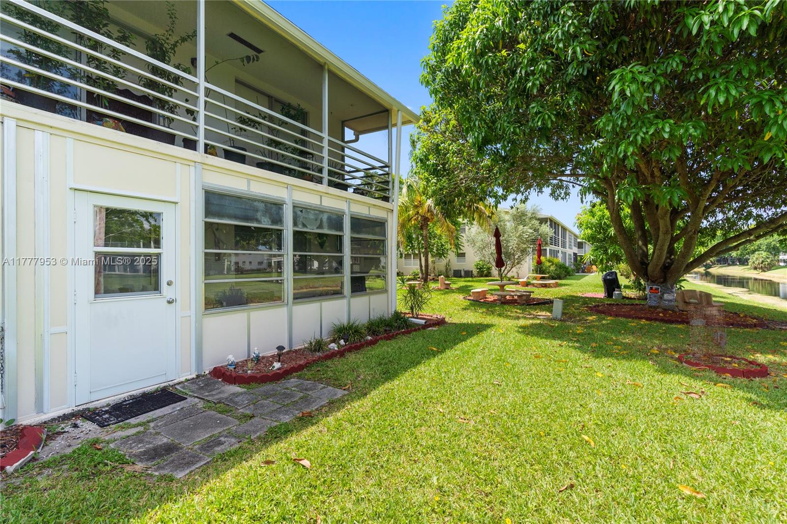 4 Markham A, Unit 4 Deerfield Beach, FL 33442 - Photo 20 of 23 a view of a house with backyard and sitting area