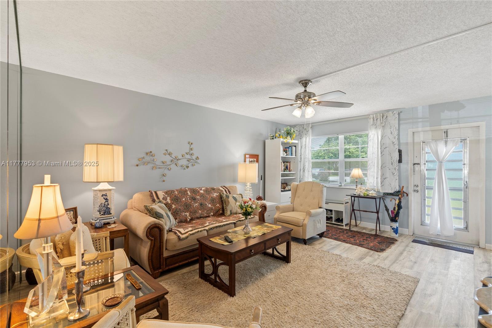 4 Markham A, Unit 4 Deerfield Beach, FL 33442 - Photo 2 of 23 a living room with furniture and a large window