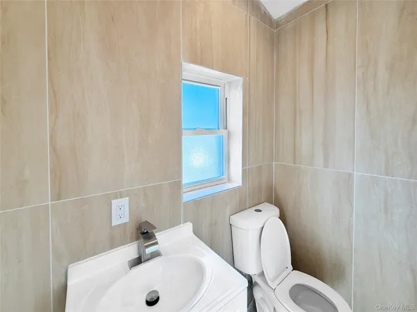 a bathroom with a sink and toilet