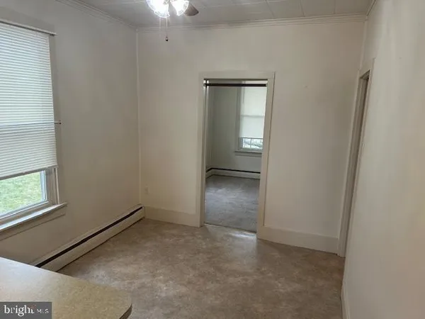 a room with window and chandelier