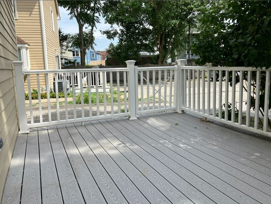61 Kondazian Street, Unit 61 Watertown, MA 02472 - Photo 11 of 11 a view of a wooden deck