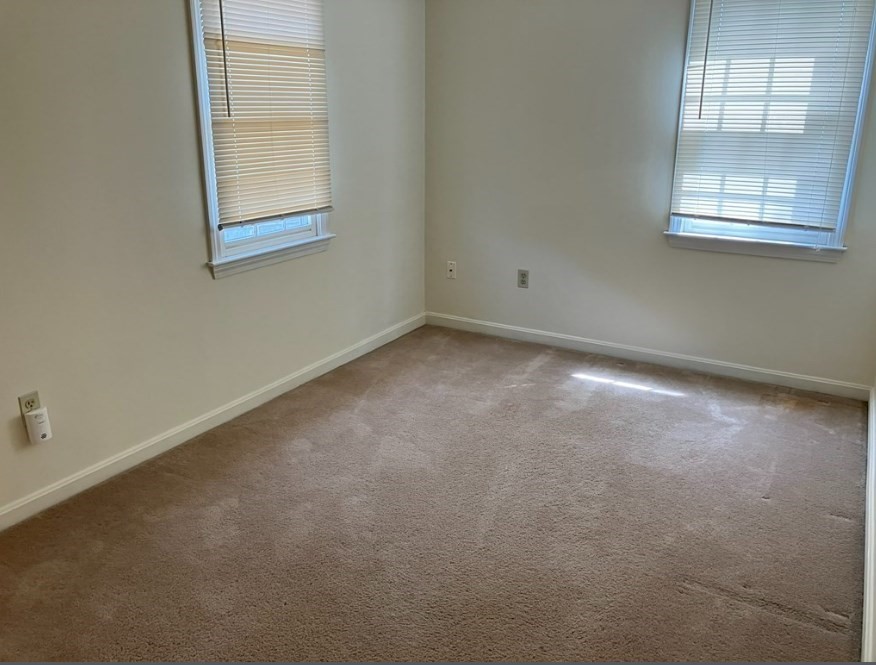 61 Kondazian Street, Unit 61 Watertown, MA 02472 - Photo 7 of 11 an empty room with a window