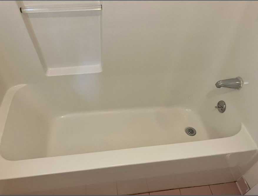 61 Kondazian Street, Unit 61 Watertown, MA 02472 - Photo 10 of 11 a bathroom with a bathtub