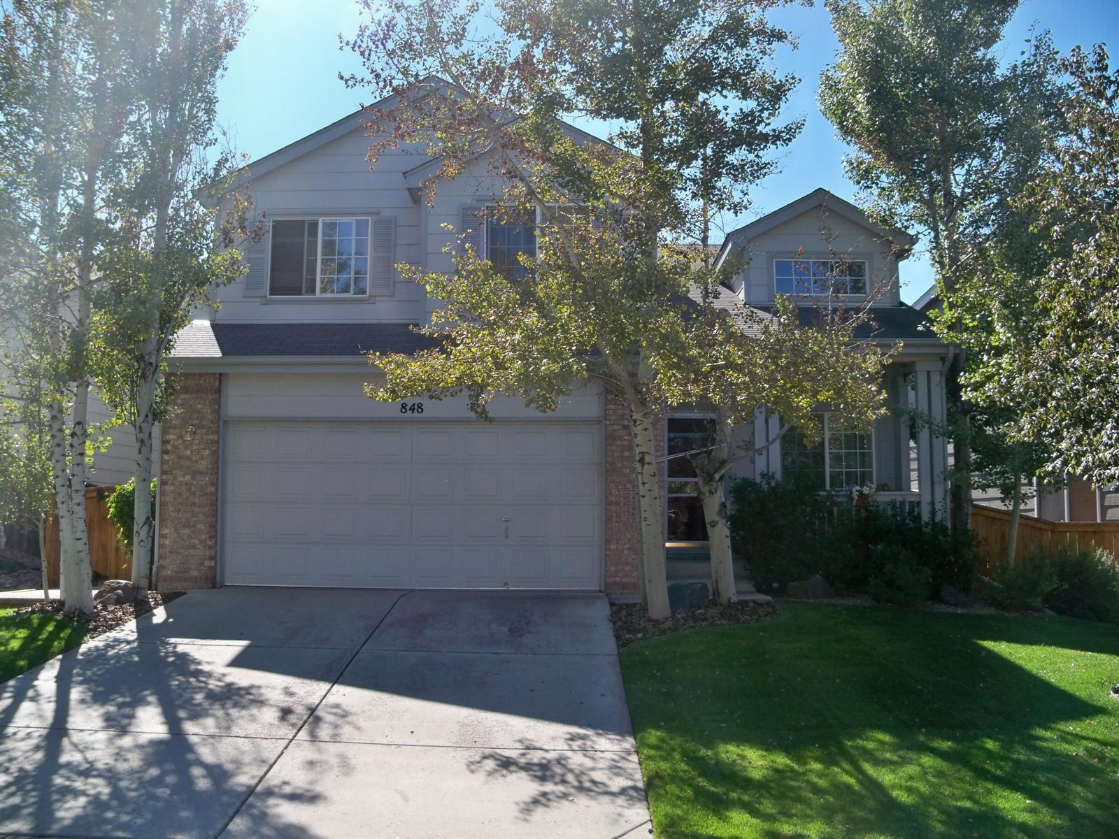 848 Timbervale Trail Highlands Ranch, CO 80129 - Photo 1 of 1 a front view of a house with garden