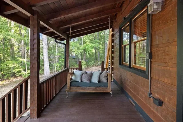 a porch with outdoor seating