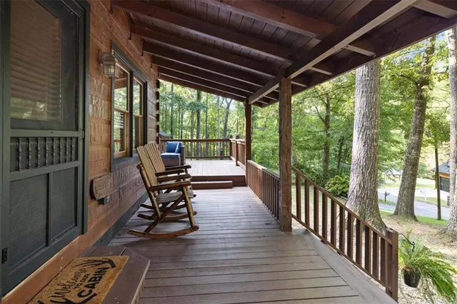 a view of a porch with wooden floor outdoor seating