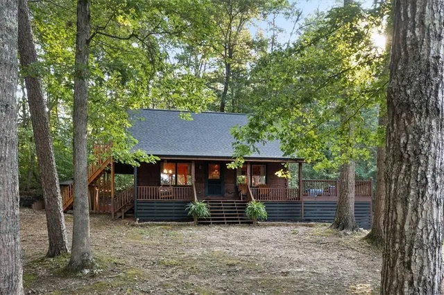 front view of a house with a tree