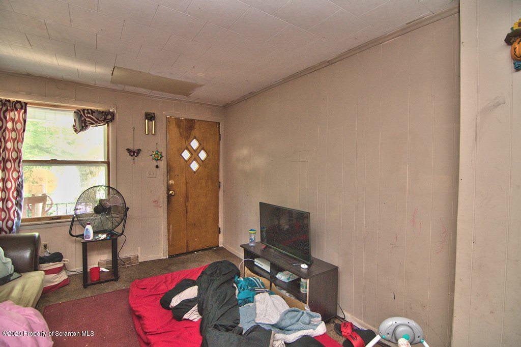 1716 Wayne Avenue Scranton, PA 18508 - Photo 17 of 42 a bedroom with furniture and a window