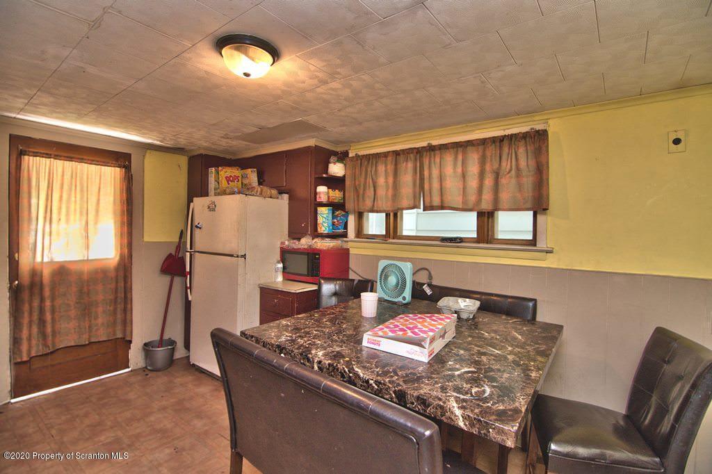 1716 Wayne Avenue Scranton, PA 18508 - Photo 20 of 42 a living room with a couch and a table