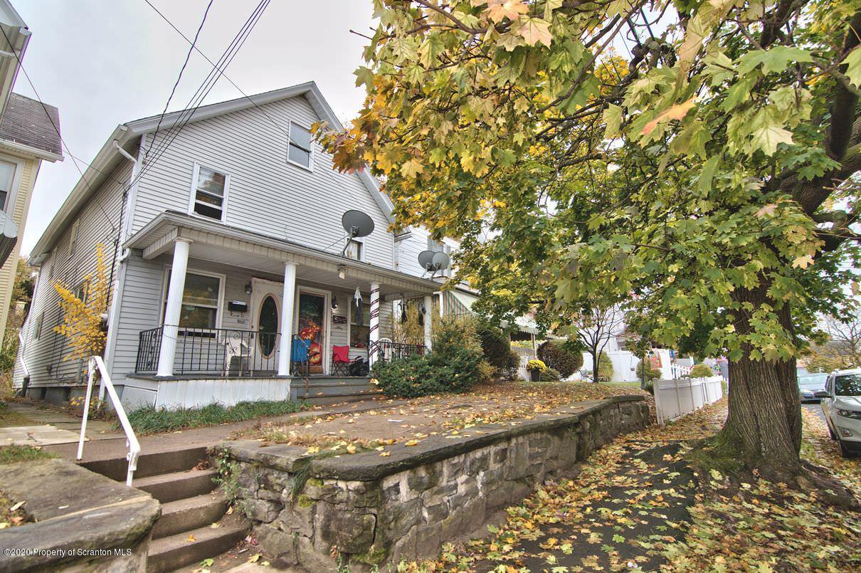 1716 Wayne Avenue Scranton, PA 18508 - Photo 2 of 42 a front view of a house with a yard