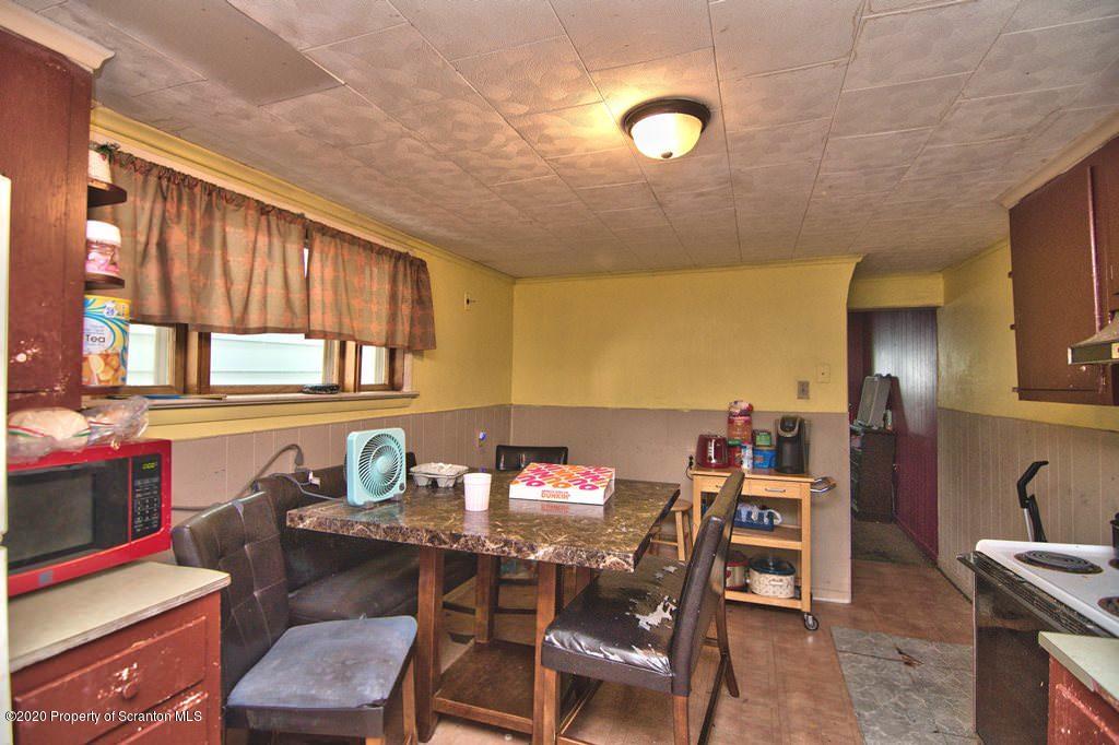 1716 Wayne Avenue Scranton, PA 18508 - Photo 21 of 42 a view of a dining room with furniture and chandelier