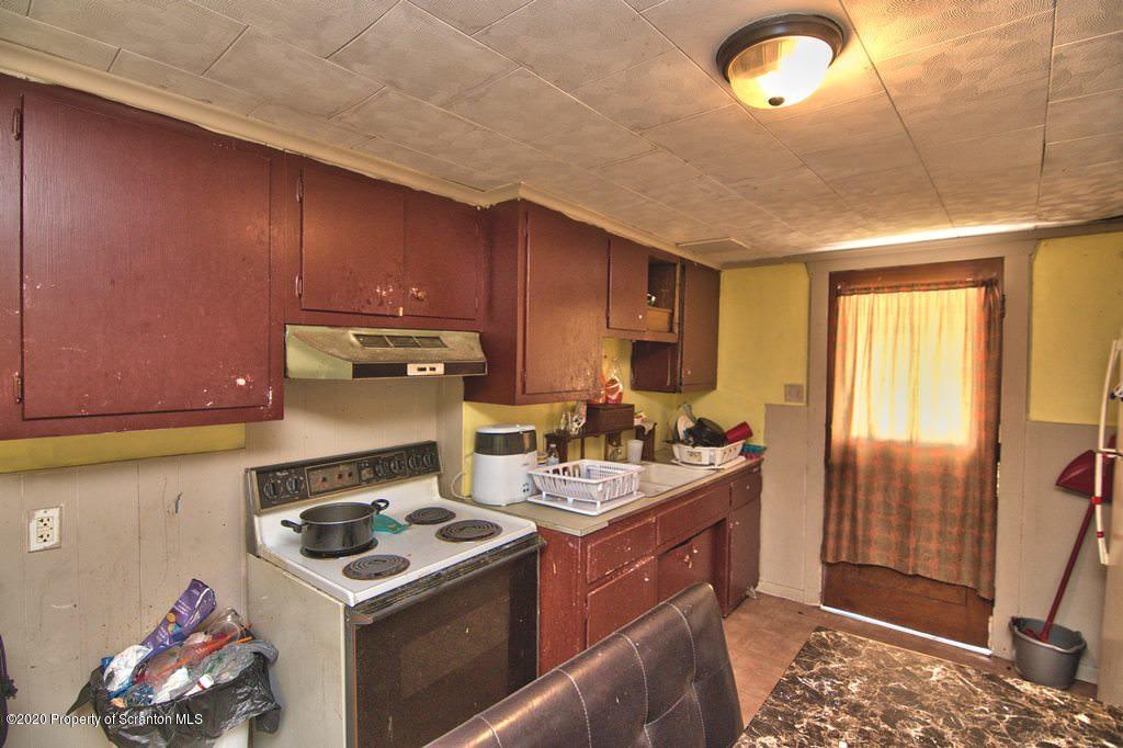 1716 Wayne Avenue Scranton, PA 18508 - Photo 23 of 42 a kitchen with a stove and a sink