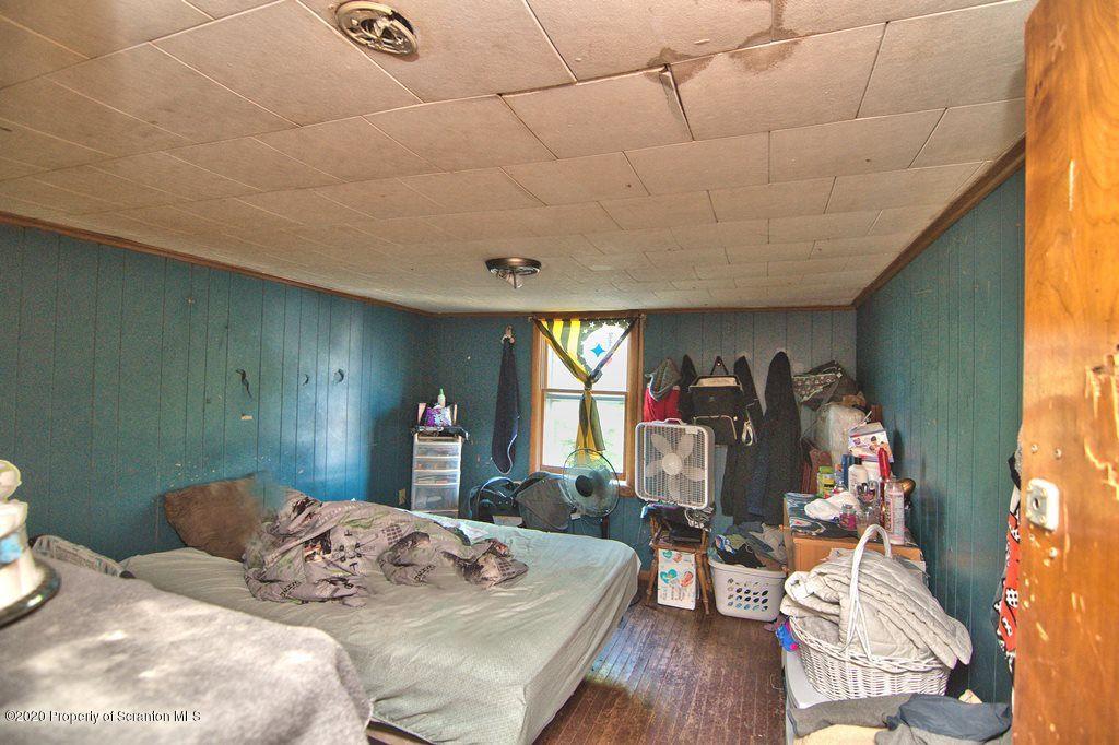 1716 Wayne Avenue Scranton, PA 18508 - Photo 24 of 42 a view of a livingroom with furniture window and wooden floor