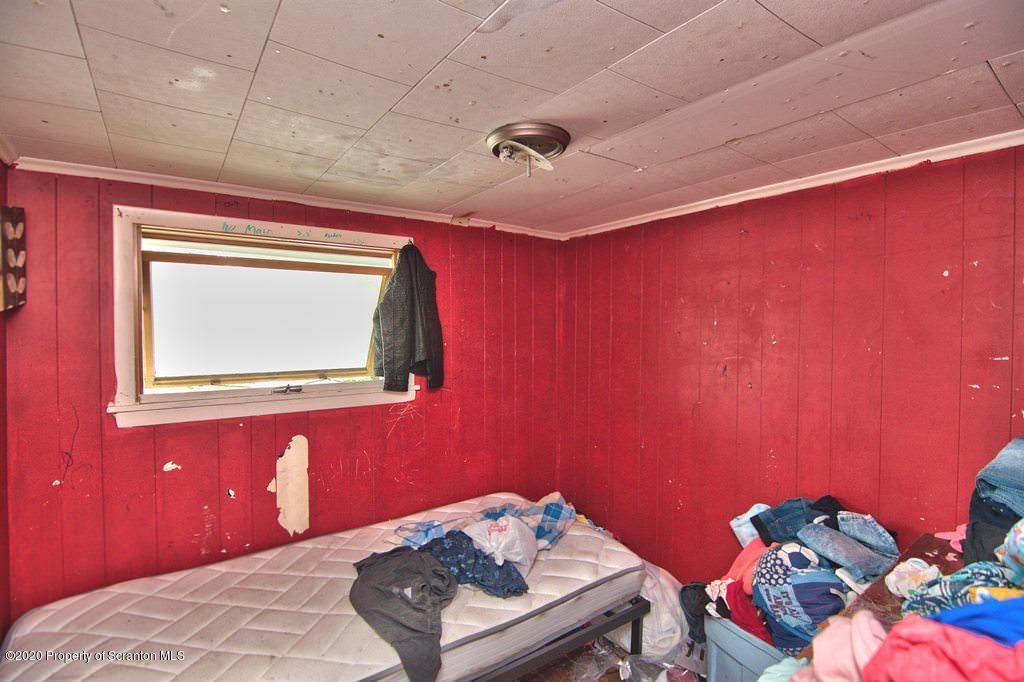 1716 Wayne Avenue Scranton, PA 18508 - Photo 25 of 42 a bedroom with a bed and a dresser