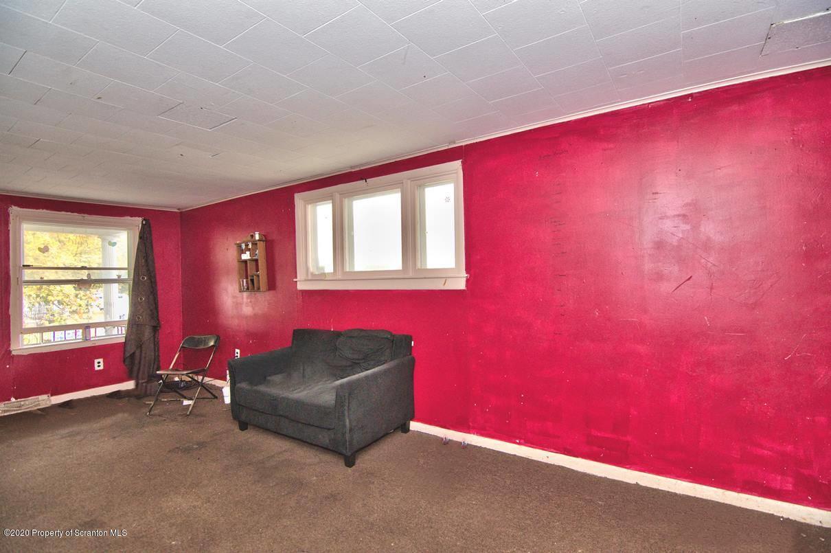 1716 Wayne Avenue Scranton, PA 18508 - Photo 30 of 42 a living room with furniture and a window