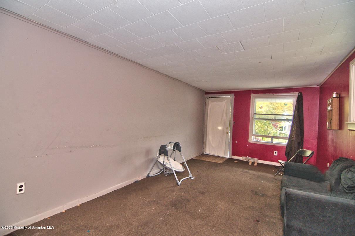 1716 Wayne Avenue Scranton, PA 18508 - Photo 31 of 42 a living room with furniture and a window