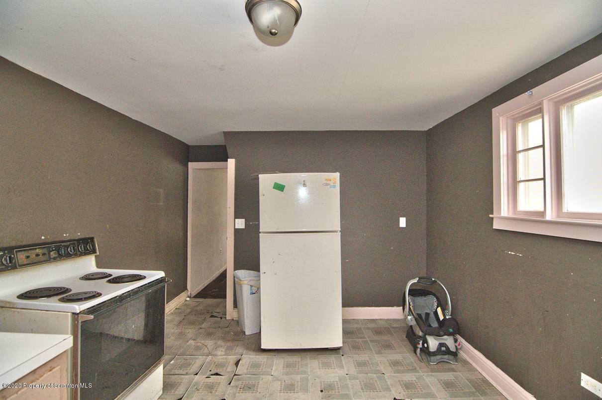 1716 Wayne Avenue Scranton, PA 18508 - Photo 34 of 42 a kitchen with a refrigerator and a stove top oven