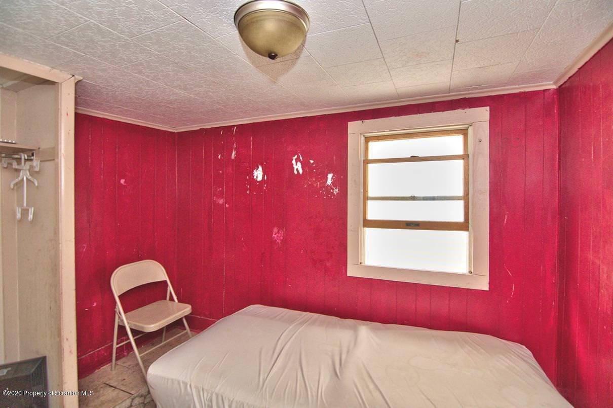 1716 Wayne Avenue Scranton, PA 18508 - Photo 40 of 42 a bedroom with a bed and a window