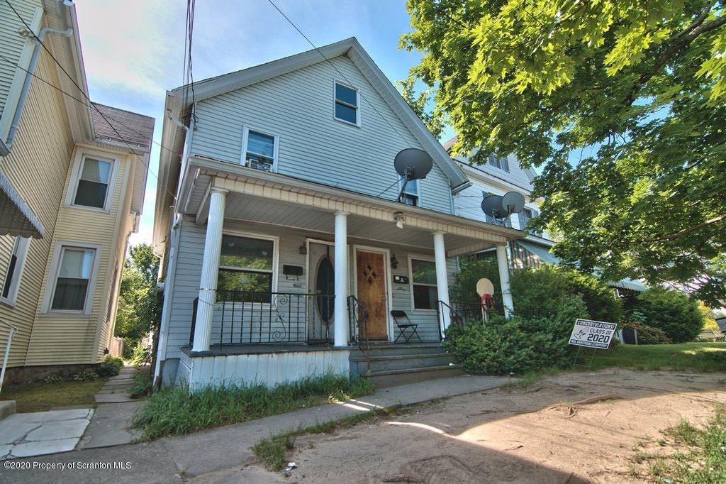 1716 Wayne Avenue Scranton, PA 18508 - Photo 5 of 42 a front view of a house with garden