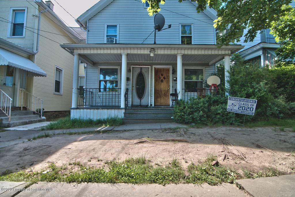 1716 Wayne Avenue Scranton, PA 18508 - Photo 6 of 42 a front view of a house with garden