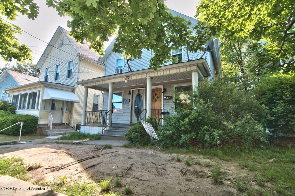 1716 Wayne Avenue Scranton, PA 18508 - Photo 7 of 42 a front view of a house with garden
