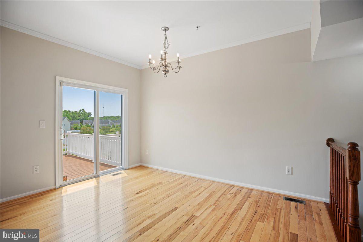 126 Backstretch Way Prince Frederick, MD 20678 - Photo 14 of 49 wooden floor in an empty room with a window