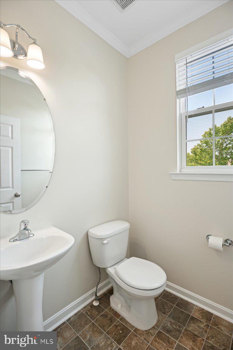 126 Backstretch Way Prince Frederick, MD 20678 - Photo 20 of 49 a bathroom with a toilet a sink and a mirror