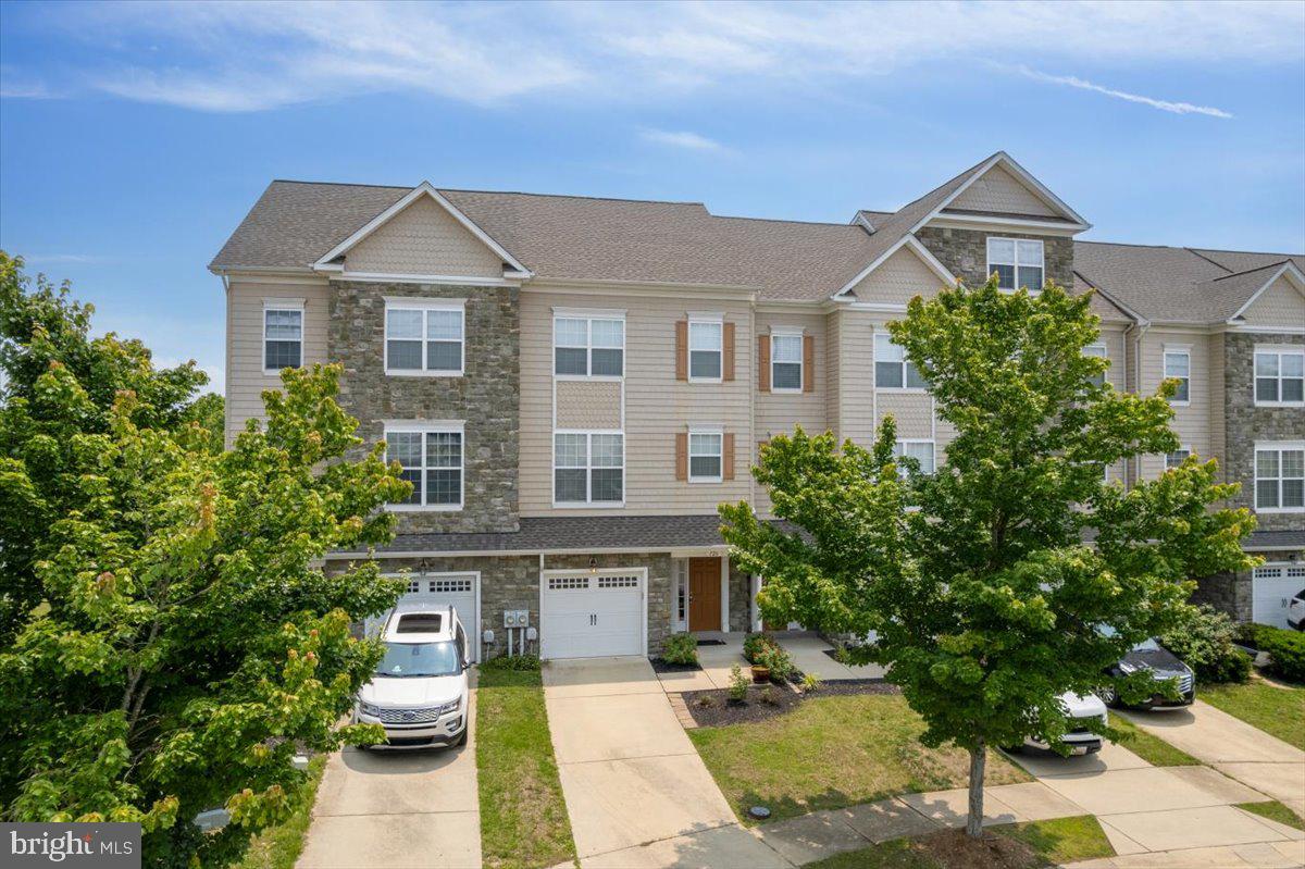 126 Backstretch Way Prince Frederick, MD 20678 - Photo 2 of 49 a front view of a house with a yard