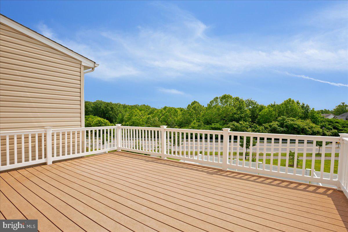 126 Backstretch Way Prince Frederick, MD 20678 - Photo 40 of 49 a view of balcony with wooden floor and fence