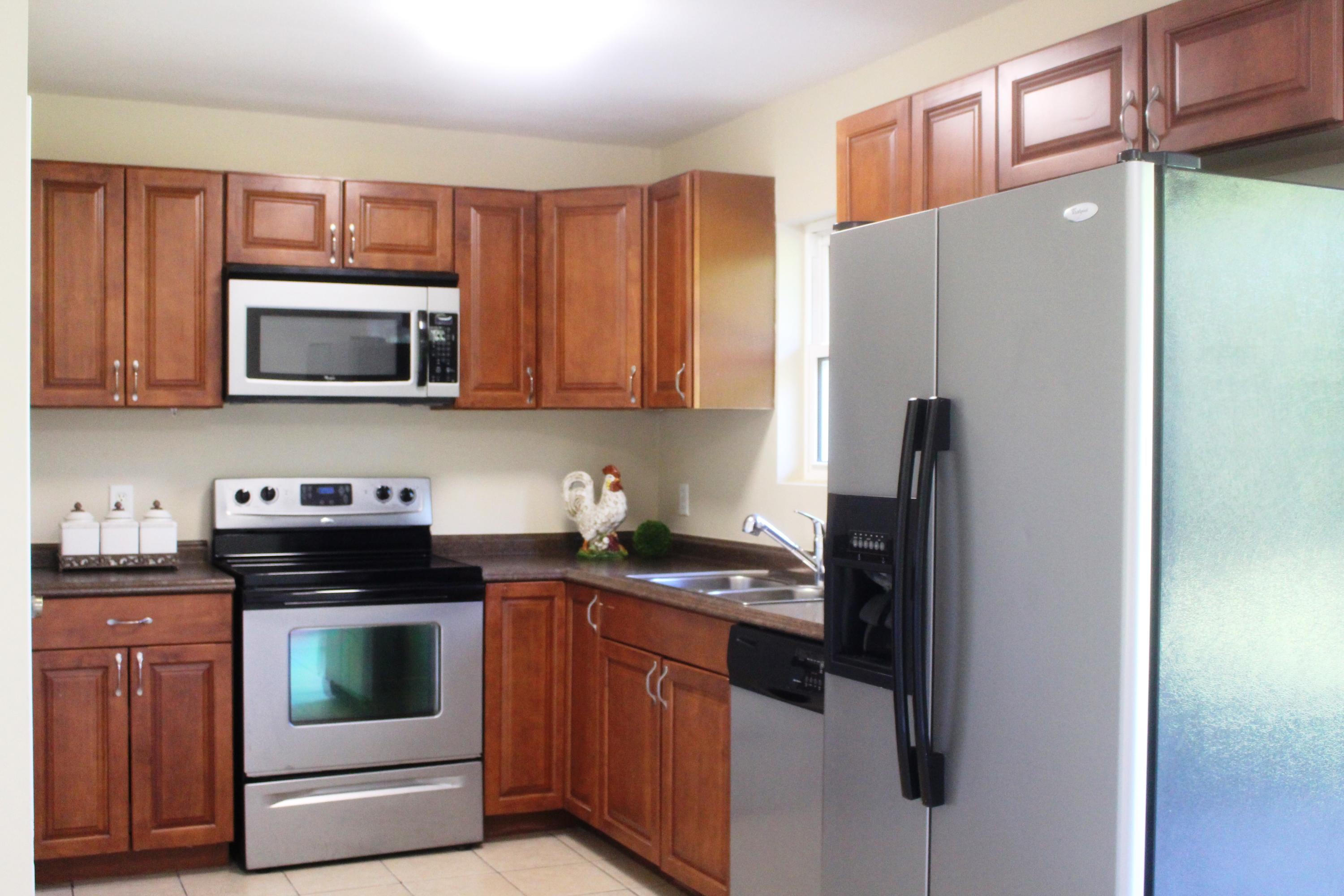 6160 Old Hickory Road Crestview, FL 32539 - Photo 1 of 12 a kitchen with a refrigerator stove and microwave