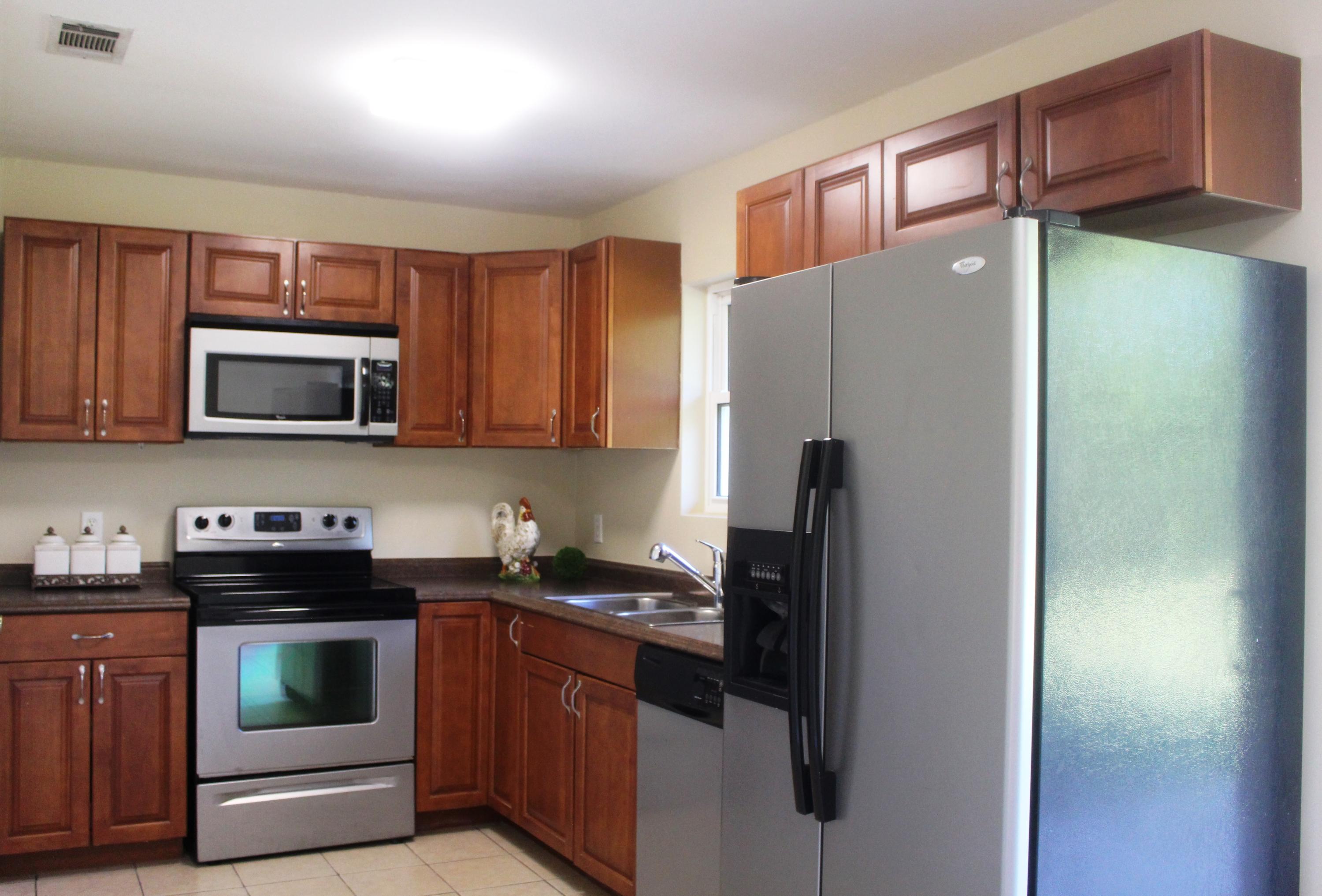 6160 Old Hickory Road Crestview, FL 32539 - Photo 3 of 12 a kitchen with stainless steel appliances granite countertop a refrigerator and a stove top oven