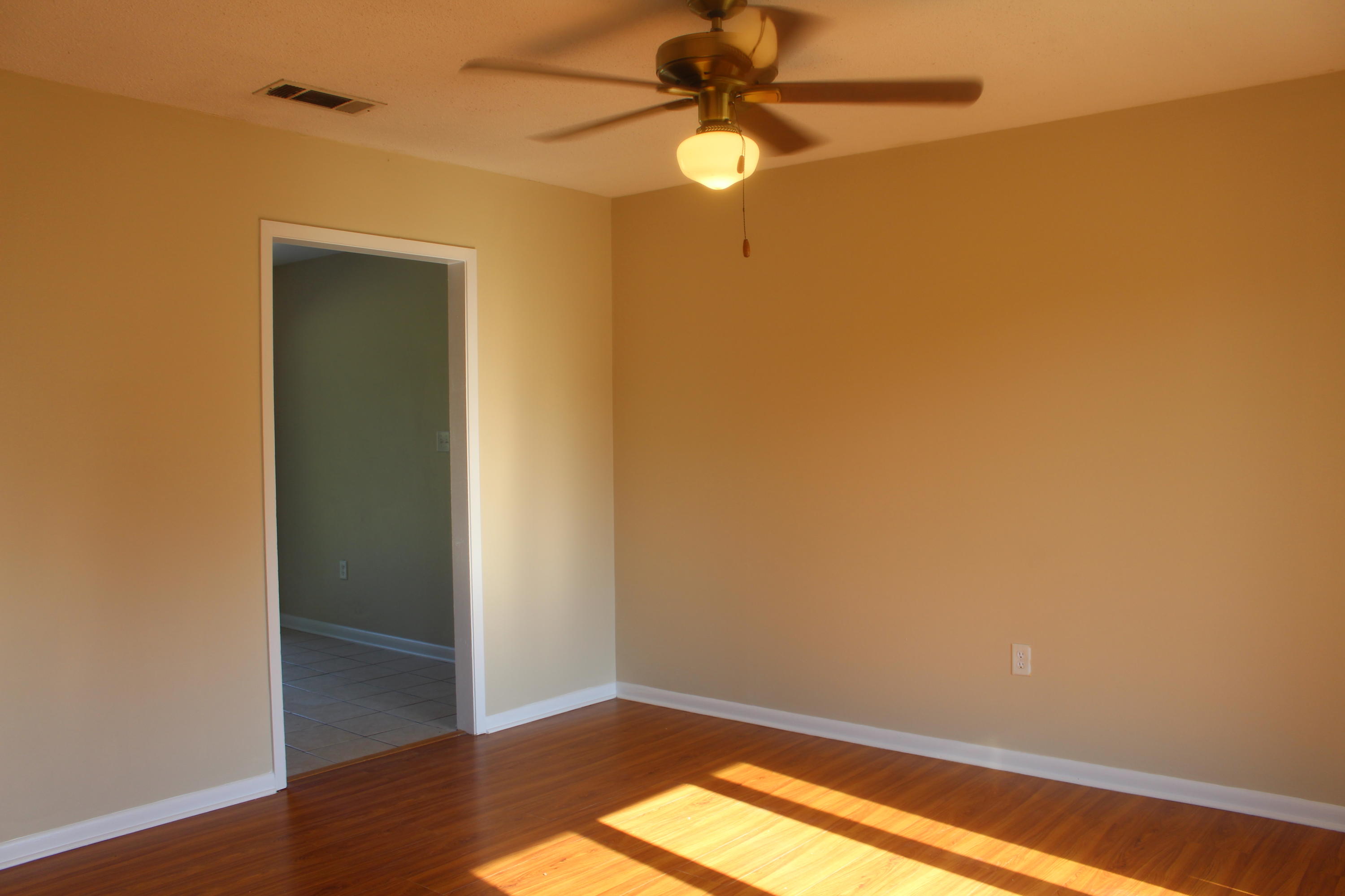 6160 Old Hickory Road Crestview, FL 32539 - Photo 6 of 12 an empty room with a window and a fan