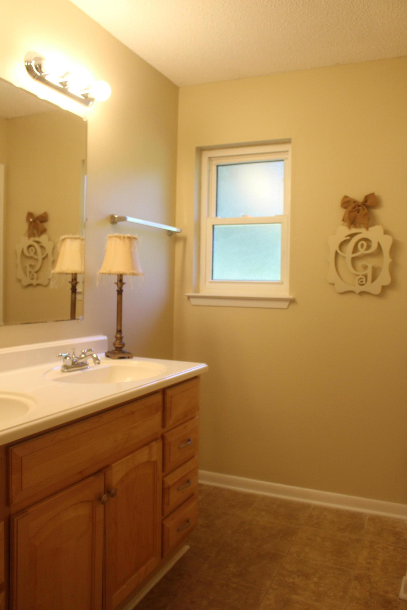 6160 Old Hickory Road Crestview, FL 32539 - Photo 8 of 12 a bathroom with a sink and a mirror
