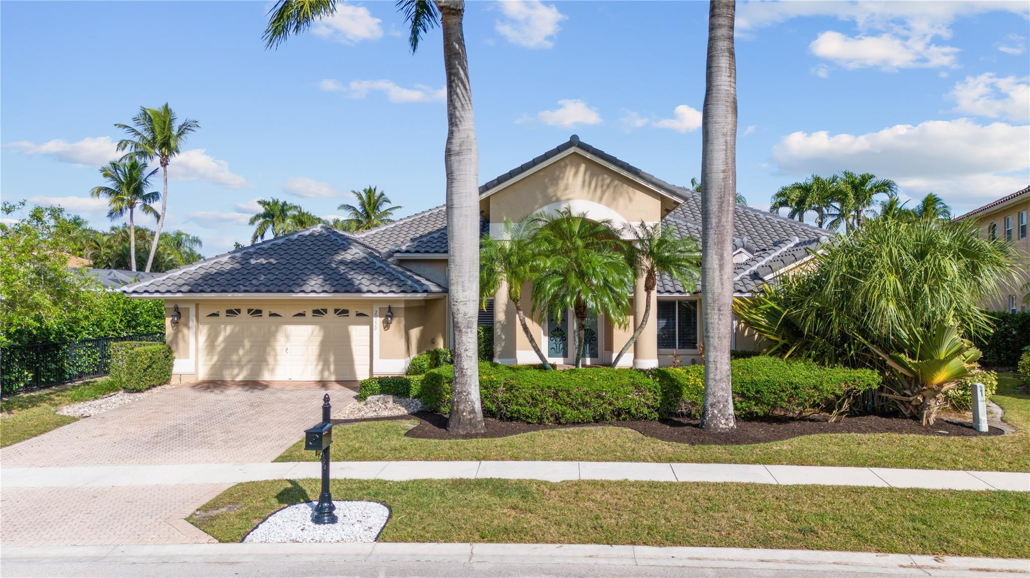 20220 Ocean Key Drive Boca Raton, FL 33498 - Photo 1 of 43 a front view of a house with garden
