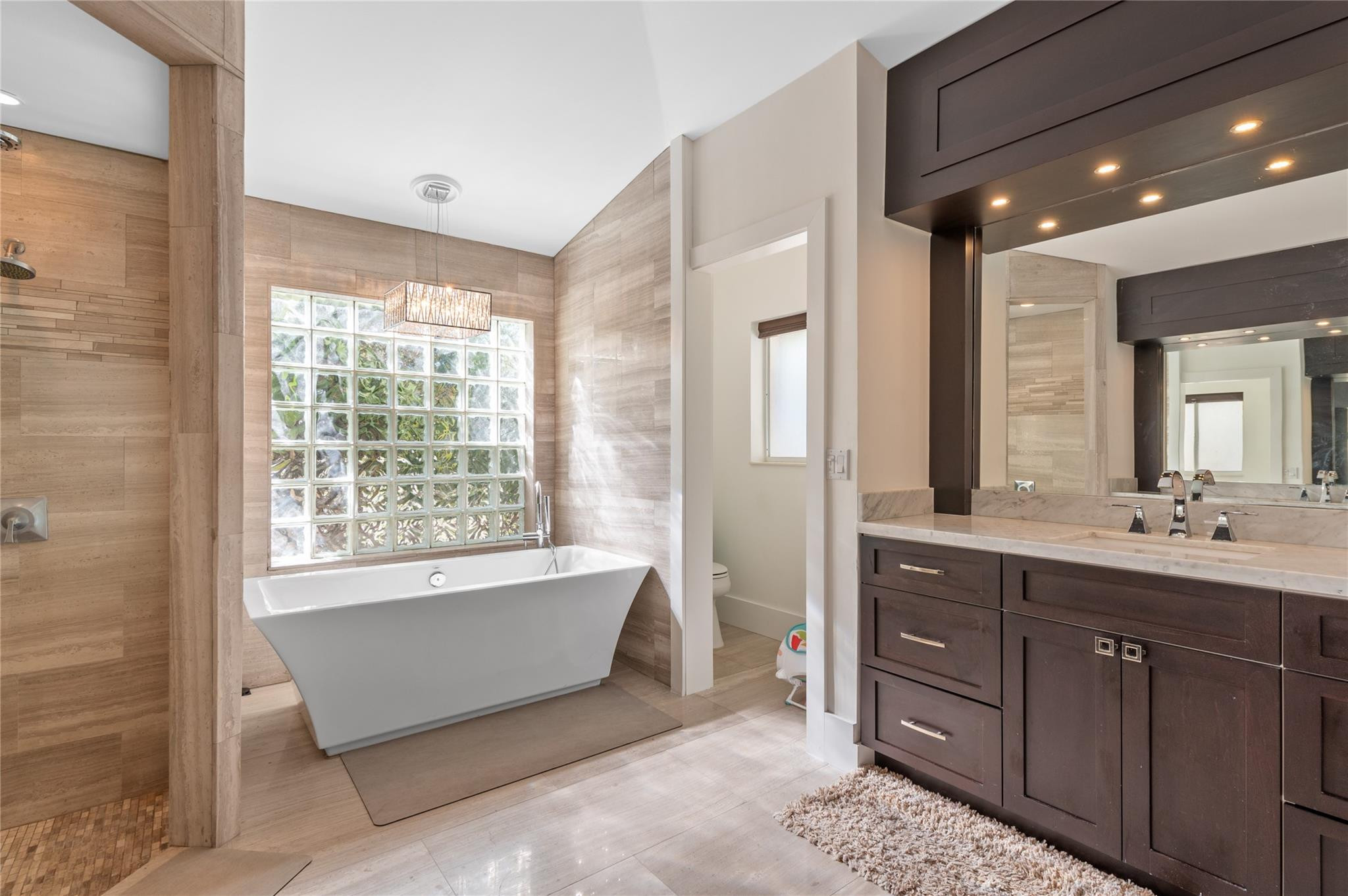 20220 Ocean Key Drive Boca Raton, FL 33498 - Photo 15 of 43 a spacious bathroom with a tub sink and mirror