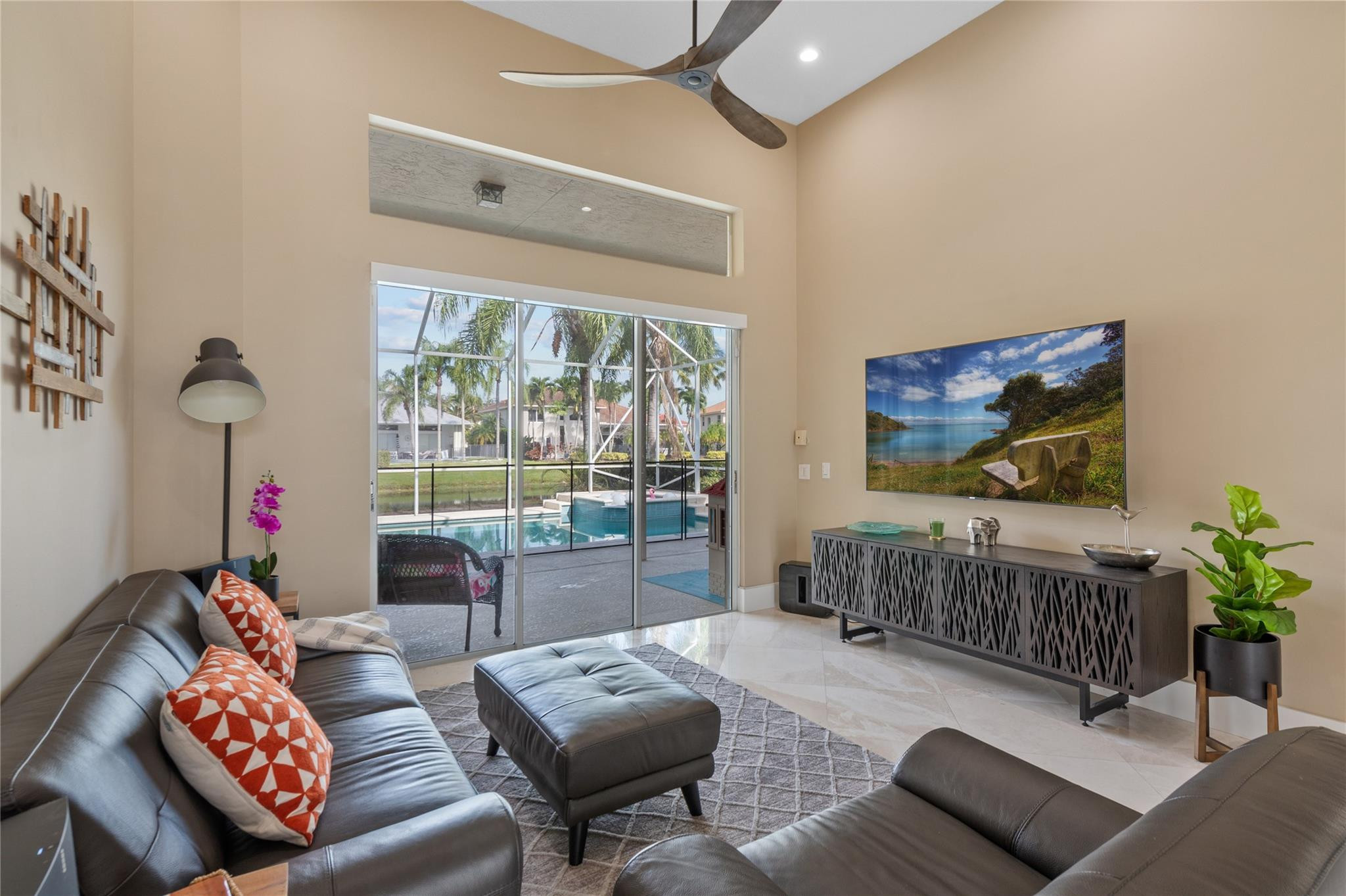 20220 Ocean Key Drive Boca Raton, FL 33498 - Photo 21 of 43 a living room with furniture and a flat screen tv