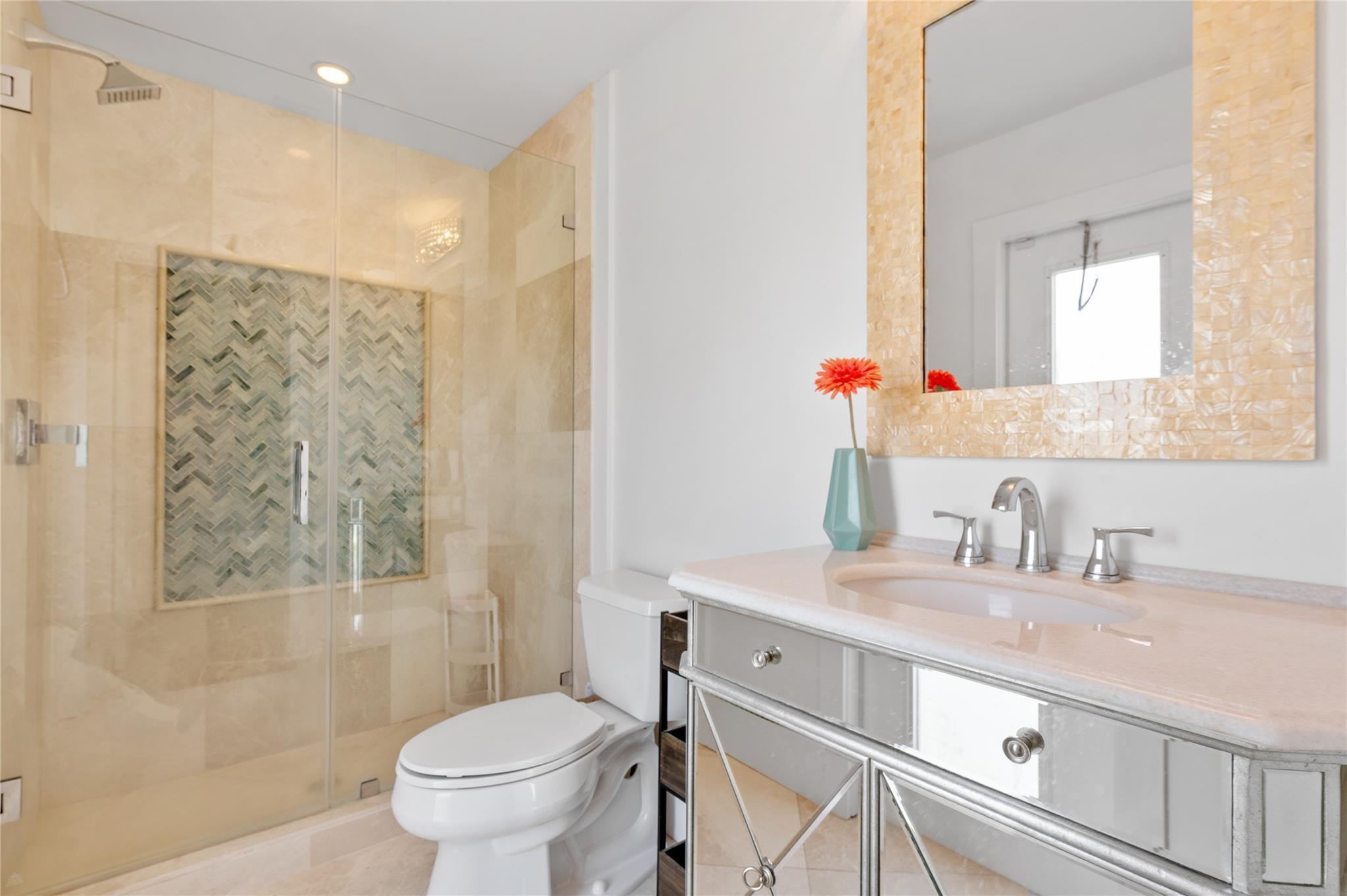 20220 Ocean Key Drive Boca Raton, FL 33498 - Photo 29 of 43 a bathroom with a sink toilet vanity and shower