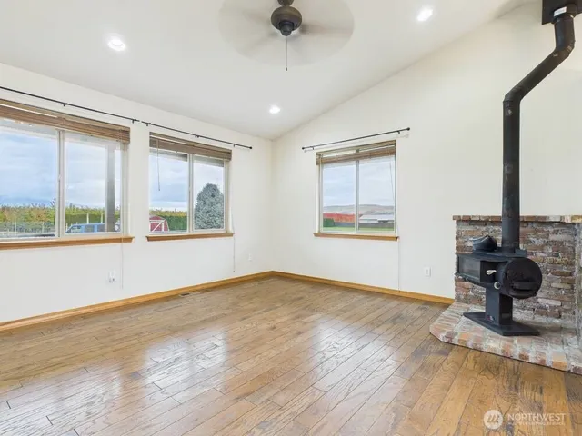 a kitchen with stainless steel appliances granite countertop a sink a refrigerator and a granite counter tops