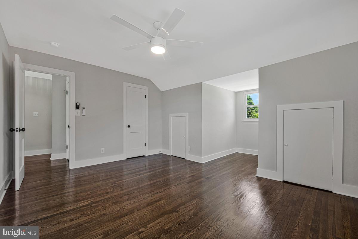 2105 Queens Chapel Road Mount Rainier, MD 20712 - Photo 14 of 33 an empty room with wooden floor & windows