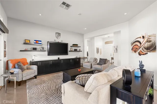 a kitchen with stainless steel appliances kitchen island granite countertop a stove and a sink
