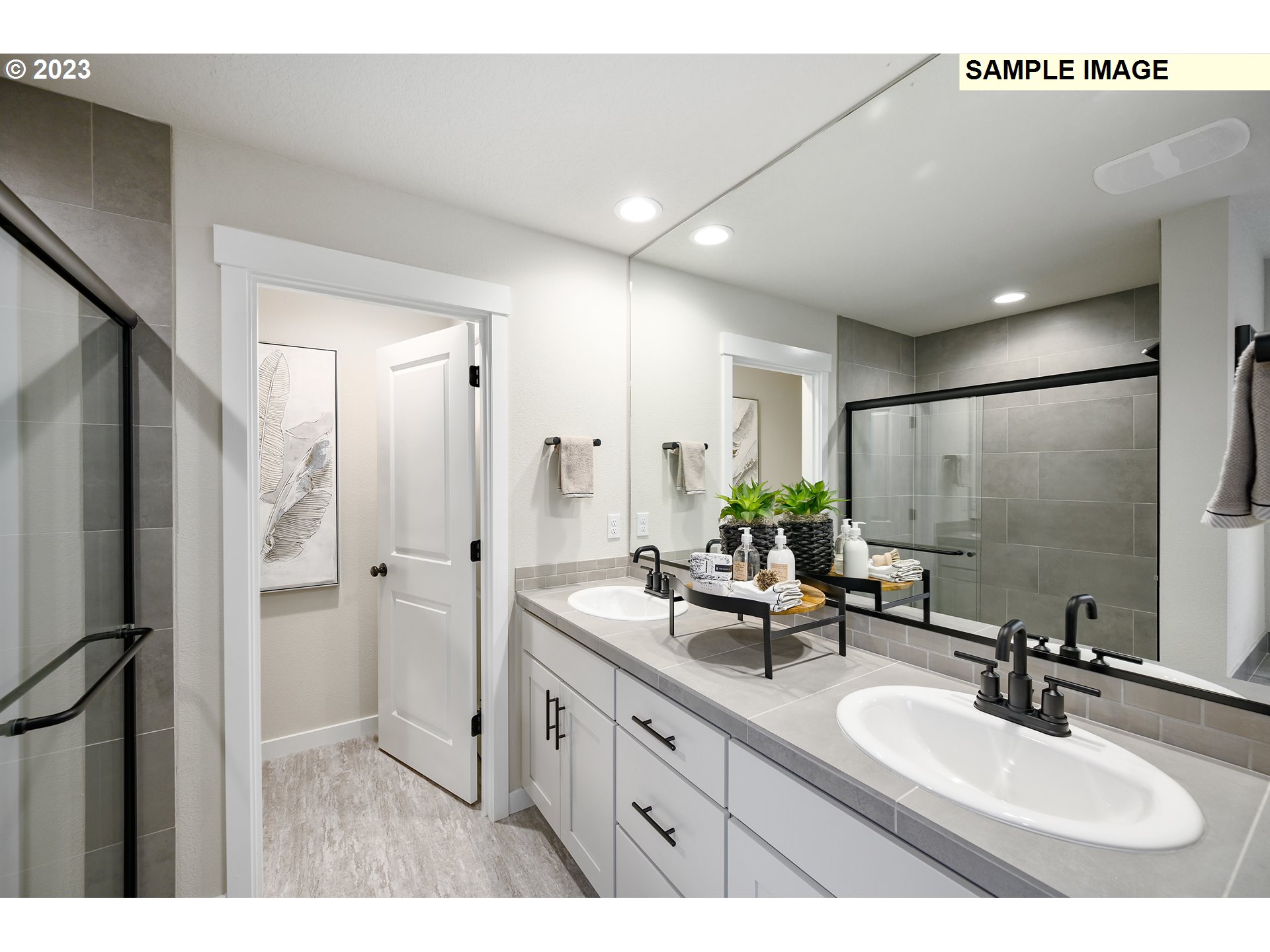 733 North Russet Place, Unit 193 Ridgefield, WA 98642 - Photo 13 of 34 a bathroom with a double vanity sink mirror and shower