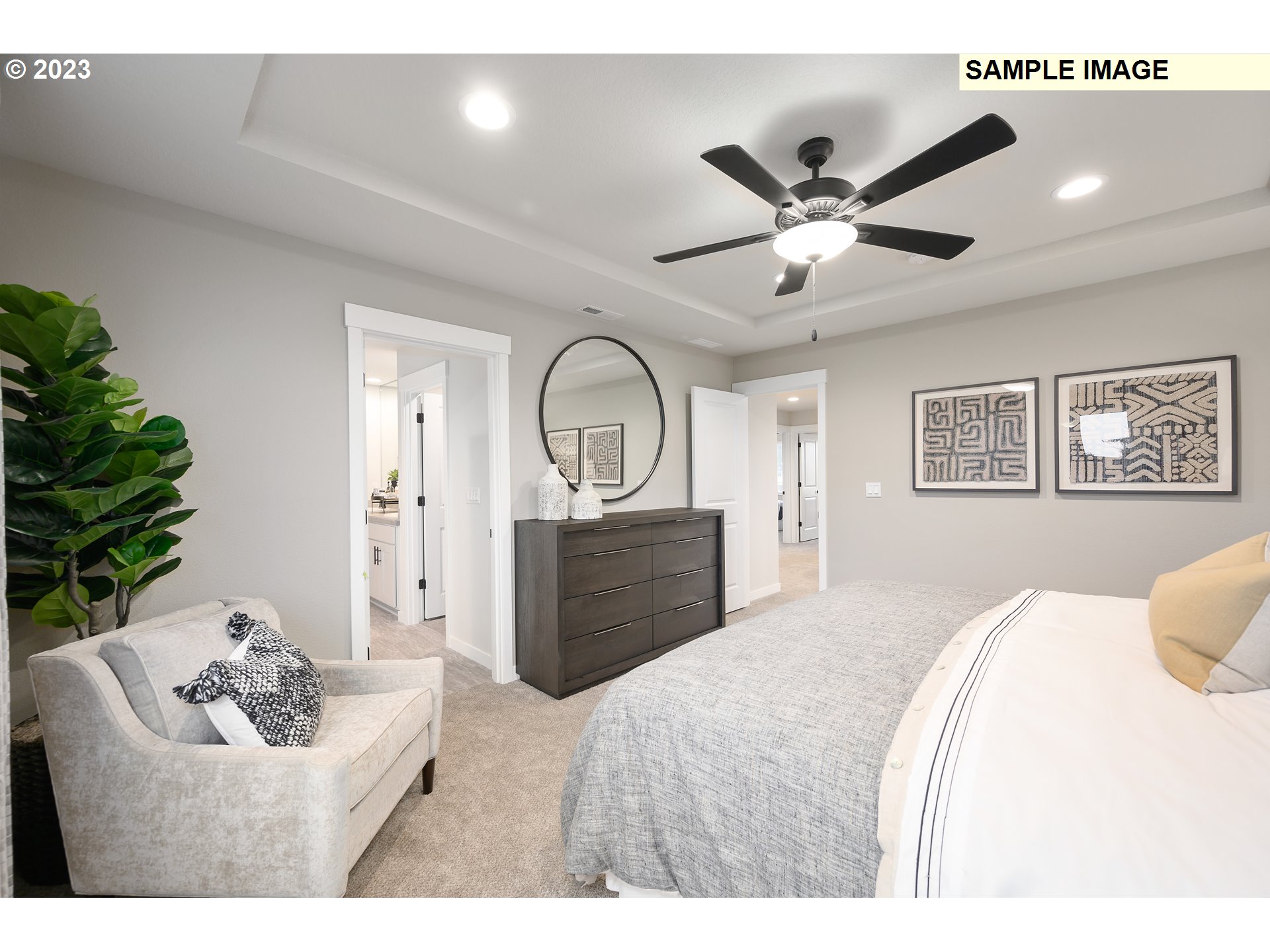 733 North Russet Place, Unit 193 Ridgefield, WA 98642 - Photo 16 of 34 a bedroom with a bed and a chandelier