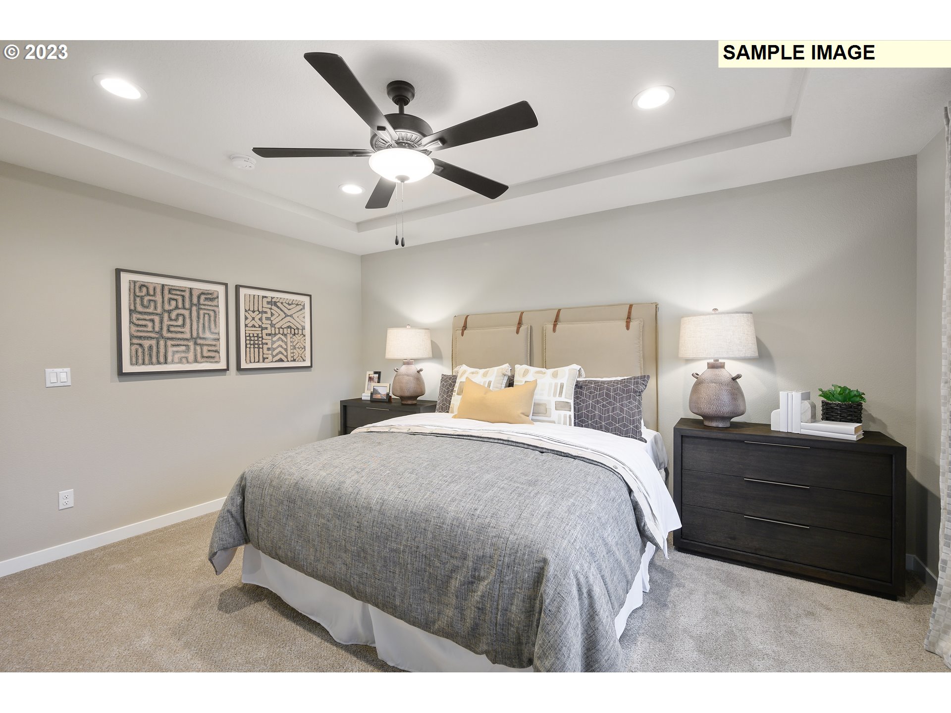 733 North Russet Place, Unit 193 Ridgefield, WA 98642 - Photo 17 of 34 a bedroom with a large bed and a chandelier