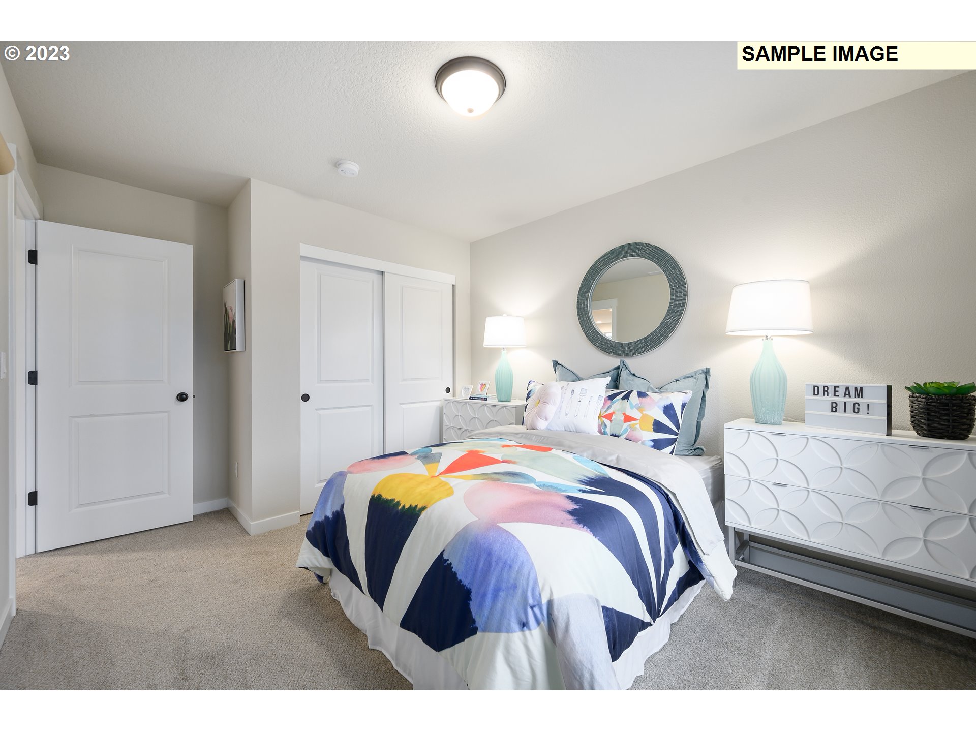 733 North Russet Place, Unit 193 Ridgefield, WA 98642 - Photo 20 of 34 a bed room with a bed and a lamp