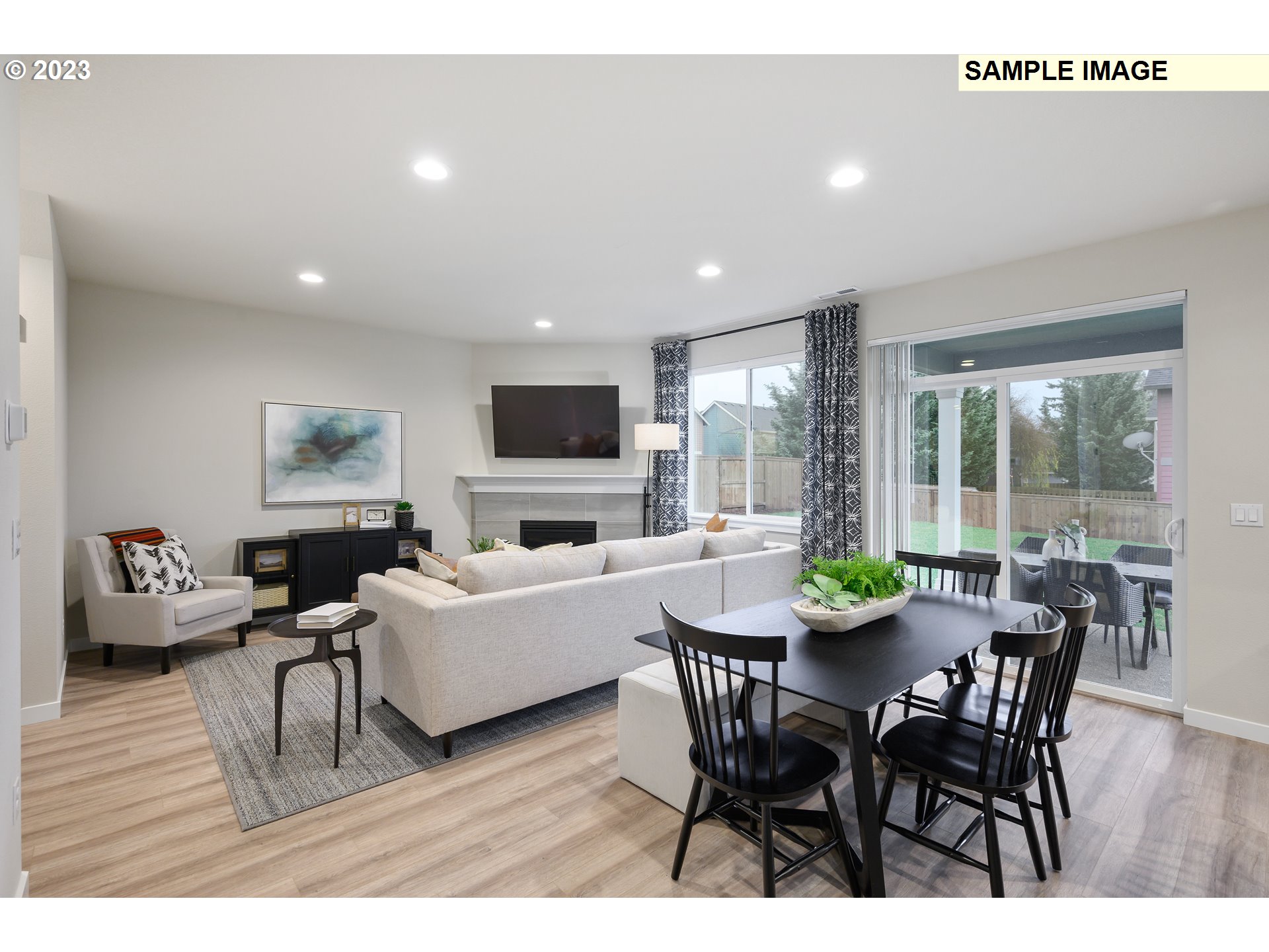 733 North Russet Place, Unit 193 Ridgefield, WA 98642 - Photo 22 of 34 a view of a dining room with furniture window and wooden floor